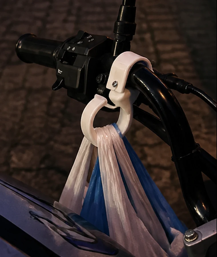 Shopping bag handles retained inside the white SHOKO Hook